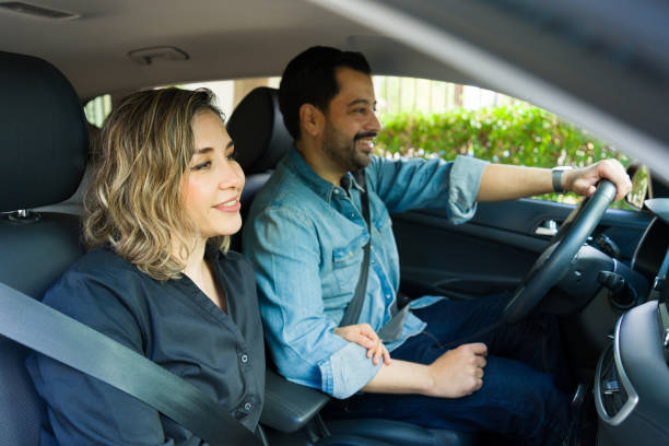 istock Romantic couple in the car going on a road trip 1851156147
