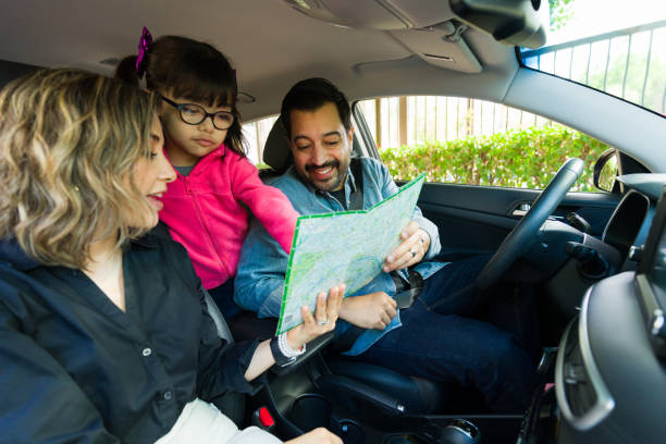 istock Mom and dad with their kid going on vacations in the car 1851156358
