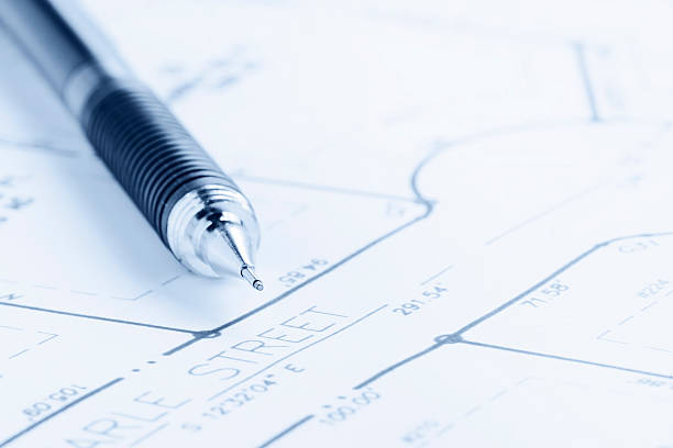 Blue Toned Residential Development Blueprint and Drafting Pencil