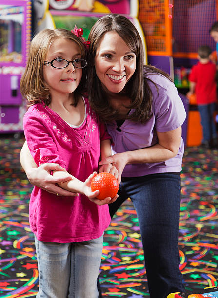 Mother and Daughter in an Amusement Arcade