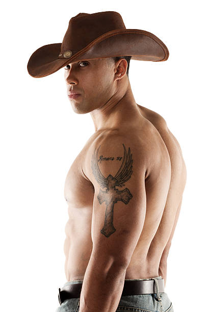 cowboy mit tattoo auf dem arm - tattoo men human arm shoulder stock-fotos und bilder