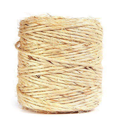 Old fashioned brown twine in a spool, isolated on white.