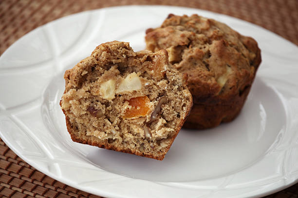 Healthy Apple, Apricot, and Walnut Muffins in Basket stock photo