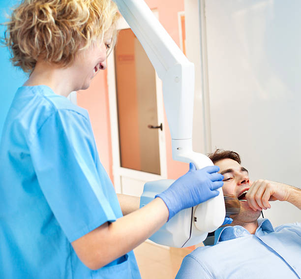 istock Dentist Professional Preparing  X-Ray for Patient 185117244
