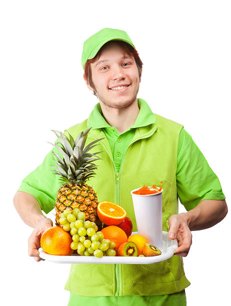 istock Friendly Bartender in Green Uniform Holding a Tray with Fruits. 185117571