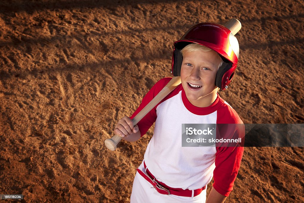 Baseball Player This is a photo a 12 year old boy standing at home plate. The focus is on the boys face and falls off on the bottom.Click on the links below to view lightboxes. 12-13 Years Stock Photo