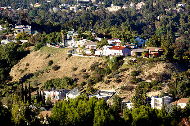 Hillside homes in Woodland Hills of the San Fernando Panoramic view of the Woodland Hills, and the San Fernando Valley of LA, CA as seen from Mullholland Drive woodland hills los angeles stock pictures, royalty-free photos & images