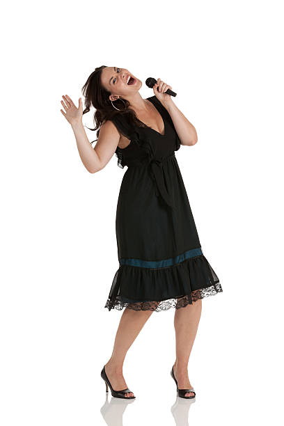 istock Woman singing into a microphone 185118717
