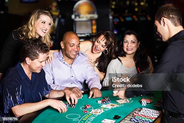 Diverse Group Of People Playing Blackjack In A Casino Stock Photo - Download Image Now