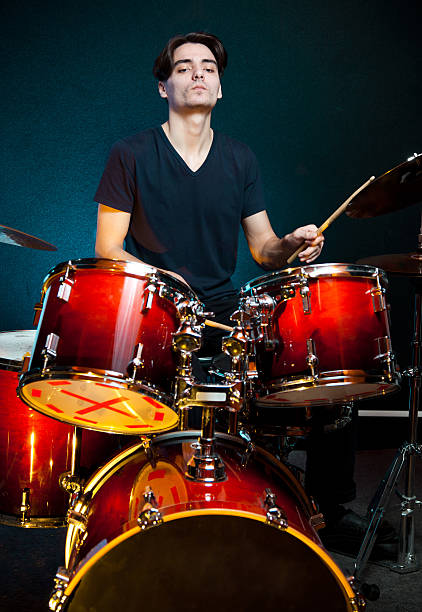istock Musician playing drums in recording studio 185119450