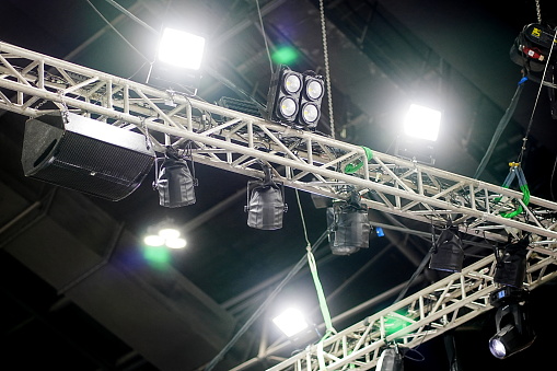 Stage multicolored lighting is hang under the roof