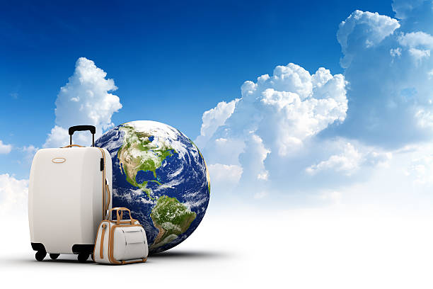 istock Rolling suitcase, bag and Earth with beautiful sky on background 185119720