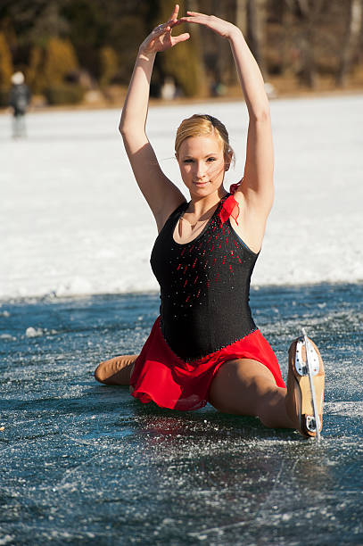 Figure skating girl on natural ice rink "Beautiful female ice skater performing attractive trick, Lake Bled, Slovenia, Europe" single skating stock pictures, royalty-free photos & images