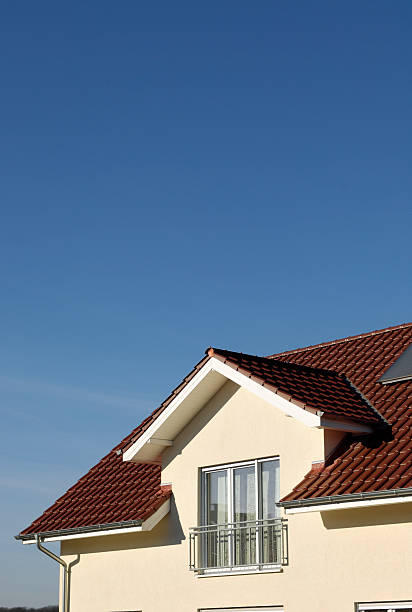 istock Yellow house and blue sky 185120622