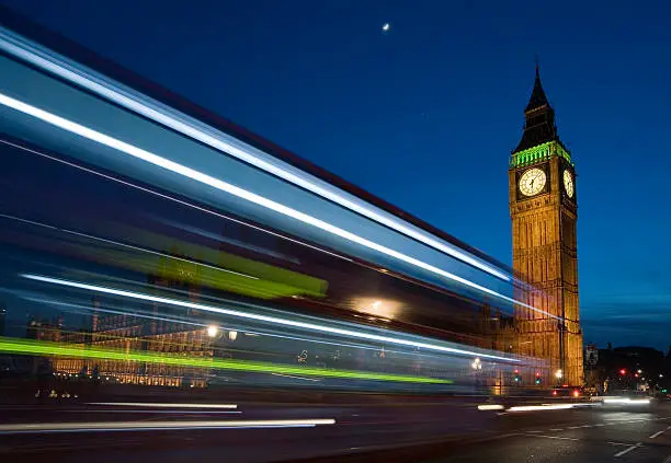 Photo of Busy night time London traffic. Big Ben.