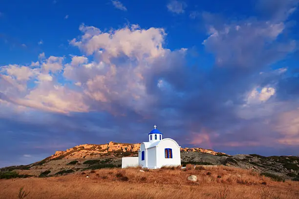 Traditional greek church on Karpathos island at sunset right after the storm.