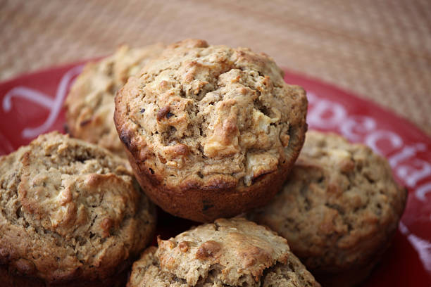 istock Healthy Apple, Apricot, and Walnut Muffins on Red Plate 185120942