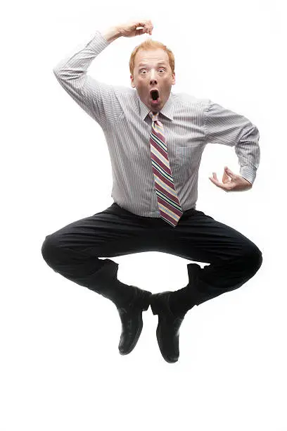 Photo of Funny businessman jumping like a monkey on White