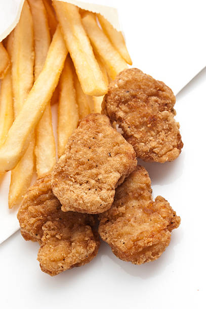 istock chicken nuggets and fries 185121521
