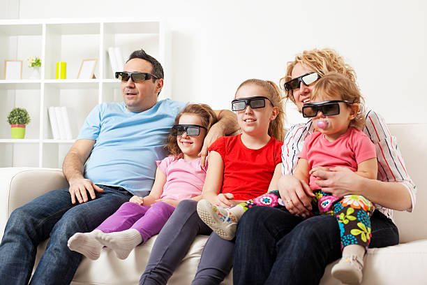 istock Family Watching TV With 3D Glasses. 185121753