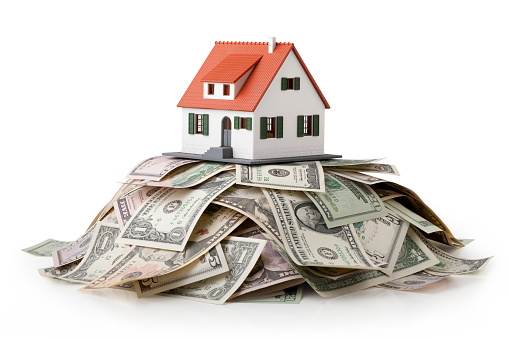 Miniature model house standing on a heap of dollar bills. Photo with clipping path.Some similar pictures from my portfolio: