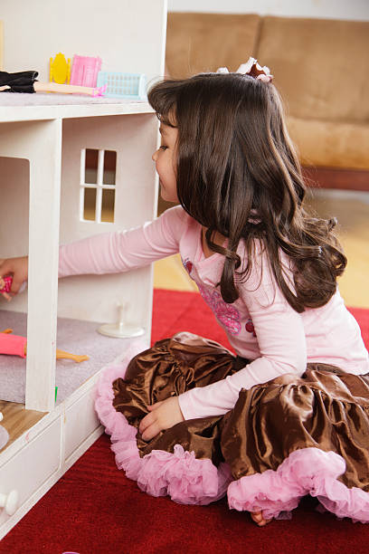 istock Little Girl with Dollhouse 185121962