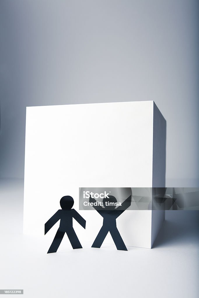 Paper people concept - brainstorming to reach the top "Two people in front of a tall, seemingly insurmountable obstacle, discussing ways to reach the top.Selection of 'people with white cube' photos:" Adversity Stock Photo