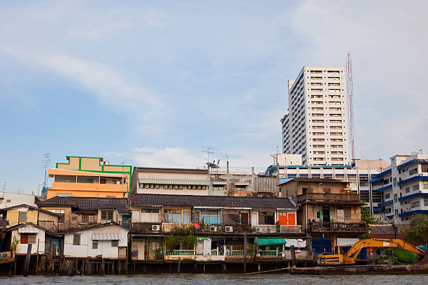 istock Old houses by the river with modern building behind 185122485