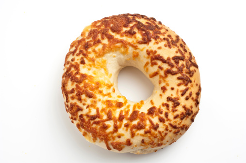One Asiago Cheese Bagels on White Background from above