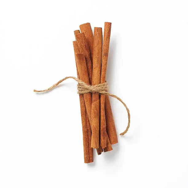 a group of 7 cinnamon sticks tied with twine