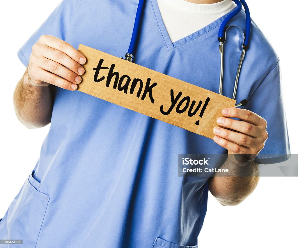 Doctor with Sign: Thank You! Unrecognizable doctor or nurse with Thank You sign Thank You - Phrase Stock Photo