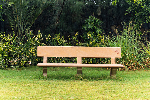 isolated bench cover at lush green park at morning from flat angle