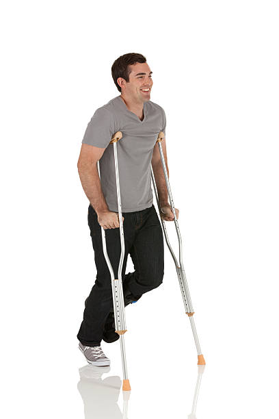 istock Injured man walking with the help of crutches 185123991