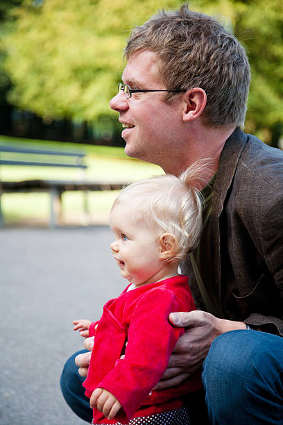 istock father and little daughter in a park 185124014