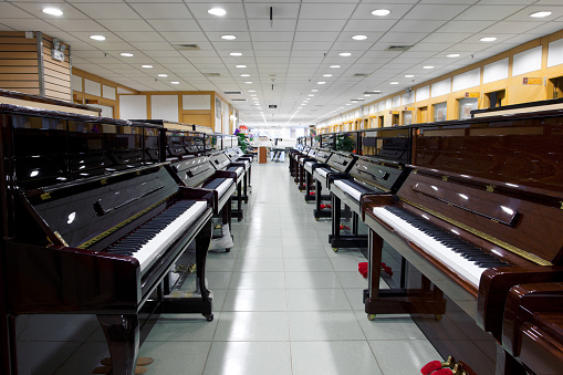 many piano in a music shop - indoors shoot