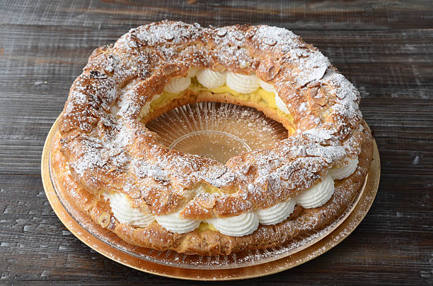 Paris-Brest Cake The classic French dessert of a ring of choux pastry filled with pastry cream was made in celebration of the famous Paris-Brest bicycle race.More images of a Paris-Brest cake: choux pastry photos stock pictures, royalty-free photos & images
