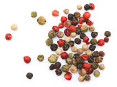 Colorful peppercorns on a white background