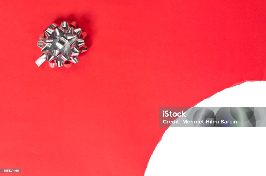 Torn red gift box Torn red gift package and gray bow isolated on white Gift Box Stock Photo