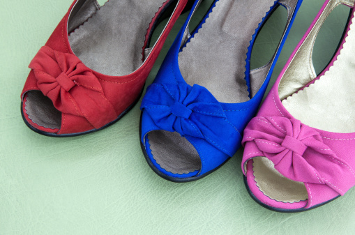 Three women's shoes in various colors