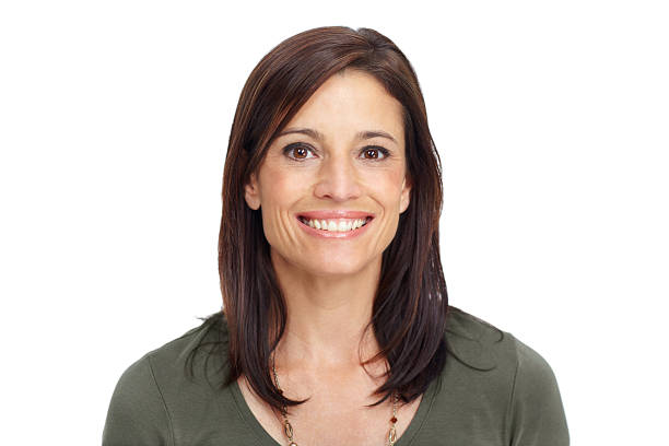 Closeup of a beautiful mature brunette woman smiling widely while isolated on white