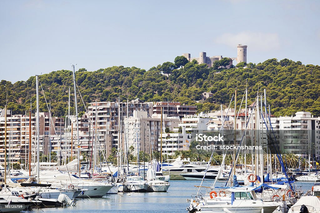 Palma Marina, Palma "The marina at Palma, Majorca,full of luxury yachts, catamarans and power boats, with adjacent waterside apartments, with a backdrop of Bellver Castle on the hilltop behind. The castle is 14th century and built to a circular configuration. Good copy space." Majorca Stock Photo