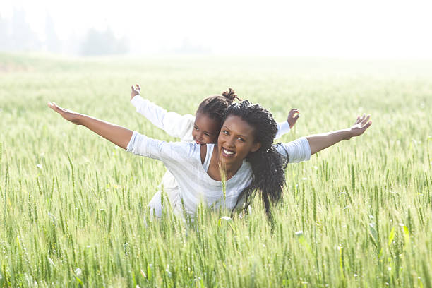 istock Piggyback carrying-mother and daughter day. 185126164