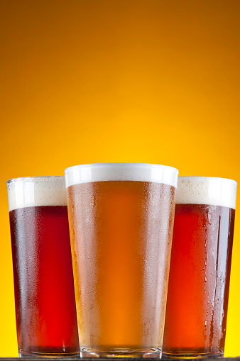 Variety of Cold Beer in Pint Glasses.