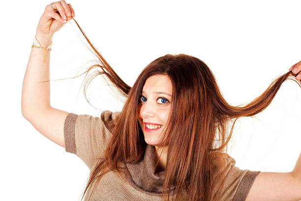 istock Young Blond Woman pulling her hair 185126380