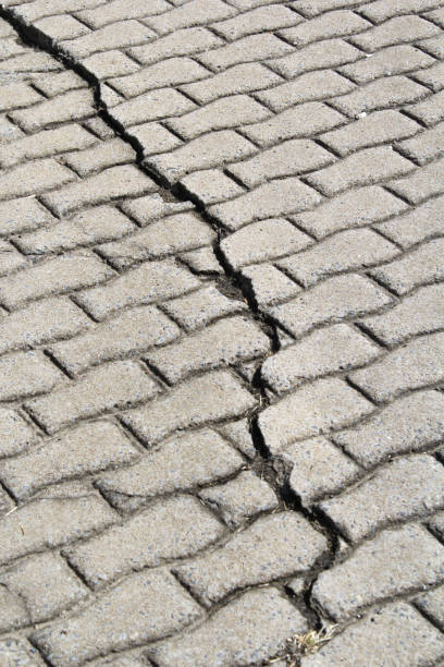 istock Close up of a cracked pavement footpath 1851266043