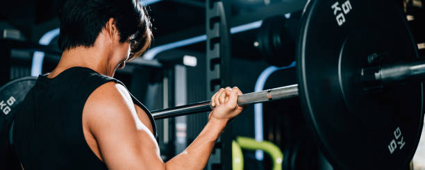 istock A determined bodybuilder lifting heavy barbells in the gym 1851268114
