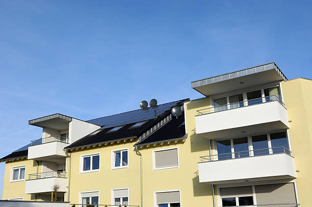 istock New yellow apartment house with solar panels 185127033