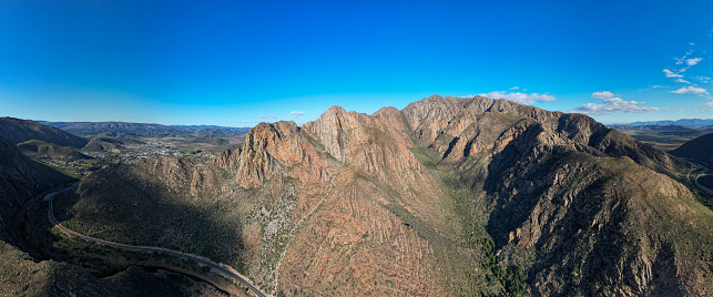 Drone shot of the large fold mountains surrounding the Montague Pass near Cape Town, South Africa