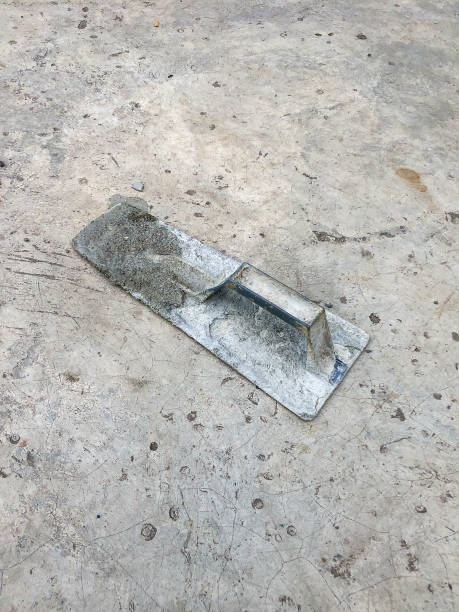 istock cement trowel on wet cement no people 1851354165