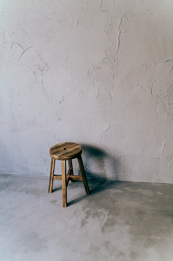 Antique round chair and white room